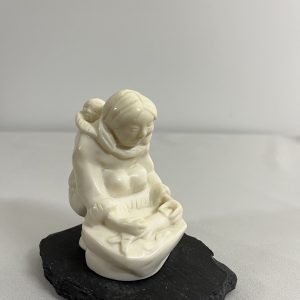 Lithe Stone Sculpture of Mother with Child Cleaning Fish